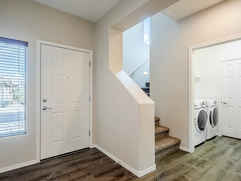Front door/laundry room/pantry and storage closet