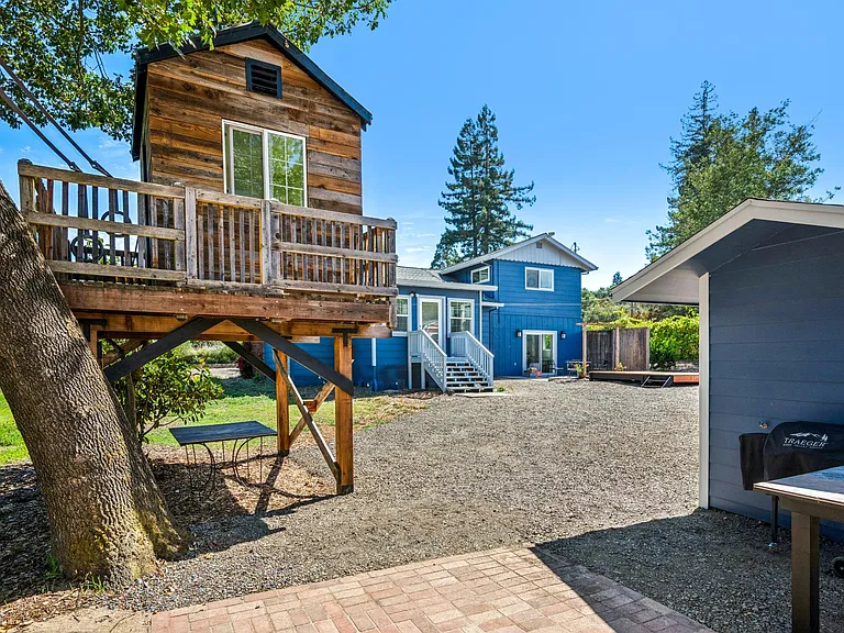 Patio under oak with smoker, BBQ and fire pit