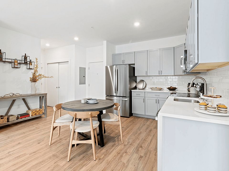 Experience culinary delight in this sleek and inviting kitchen space.