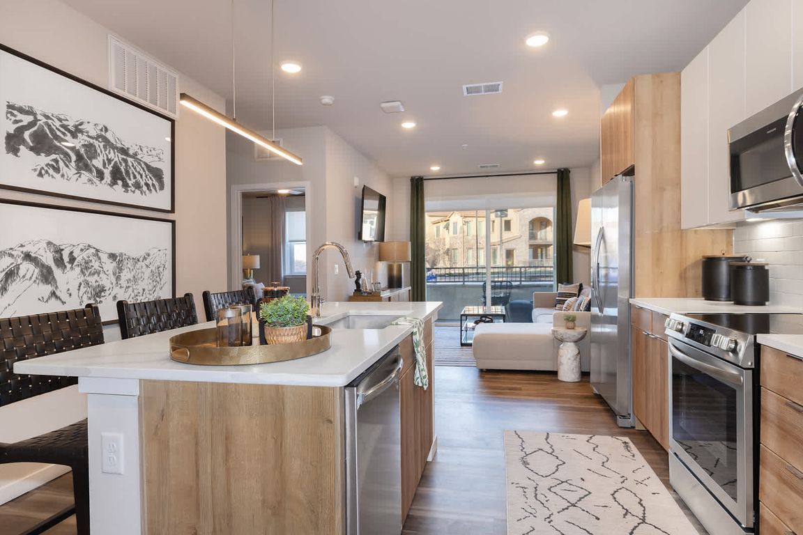 Kitchen with Stainless Steel Appliances and Quartz Countertops