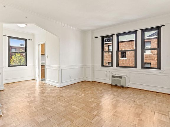 Spacious and bright living space w/ refinished hardwood floors