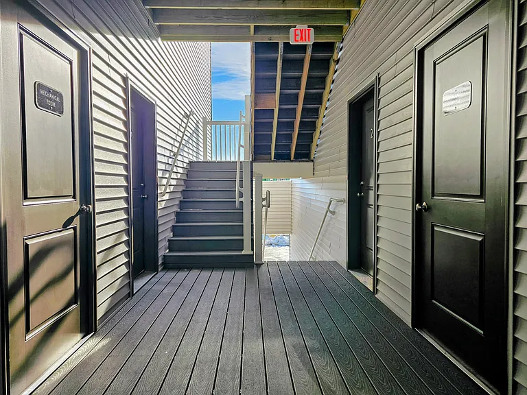 Open air breezeway entrances are well lit and convenient