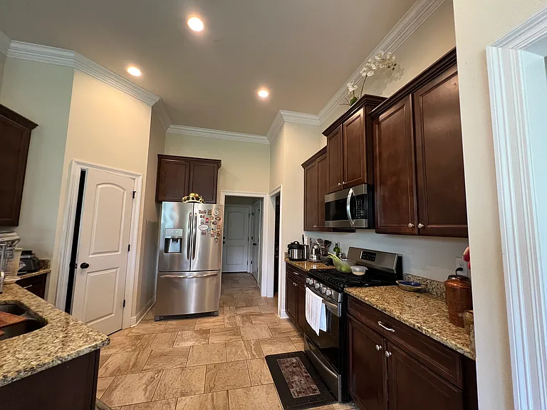 Kitchen with fridge (fridge, microwave, oven, and dishwasher included)
