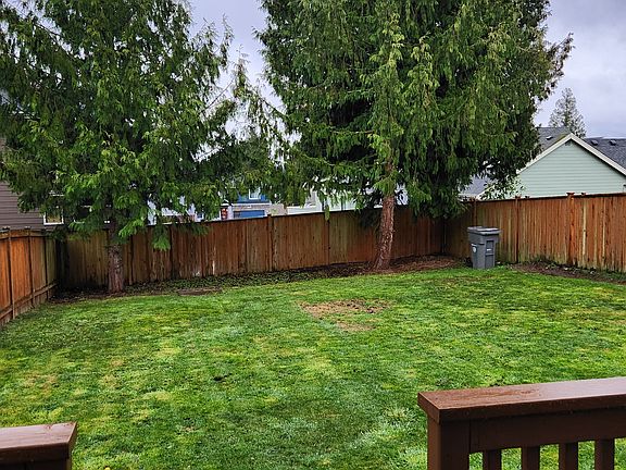 Large fenced backyard.