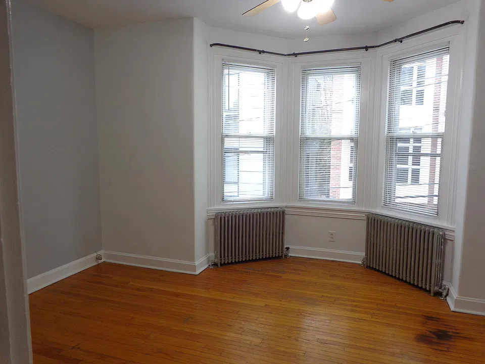 Bedroom with three windows