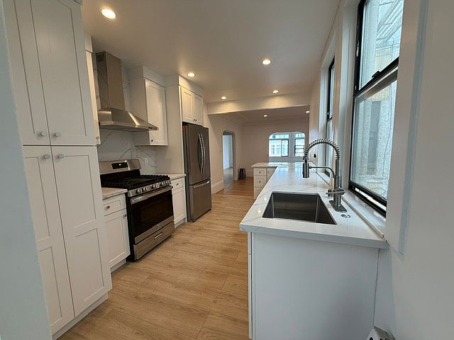 kitchen view to dining and living rooms