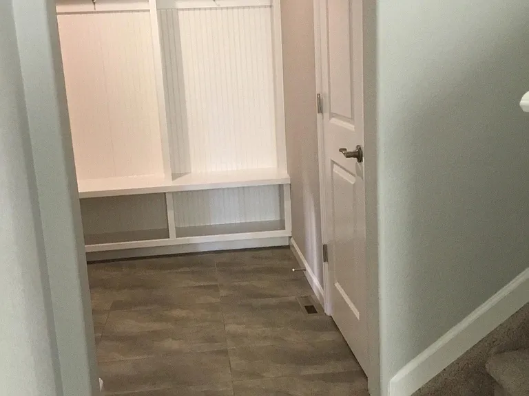 Mud room area with 3 hooks, cubbies and bench (storage over top and under bench)