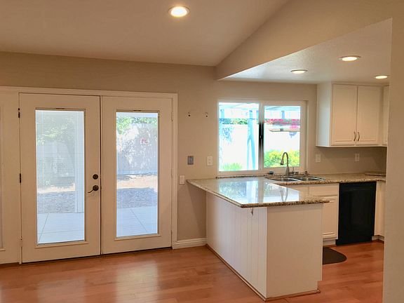 French doors with blinds between double-pane glasses - you can adjust the amount of sunlight that comes in and blinds never need dusting. French doors provide easy access from kitchen to patio.