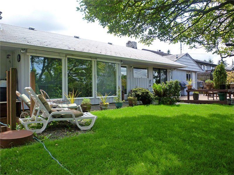 The three large double paned picture windows look out to a great territorial view of the mountains a