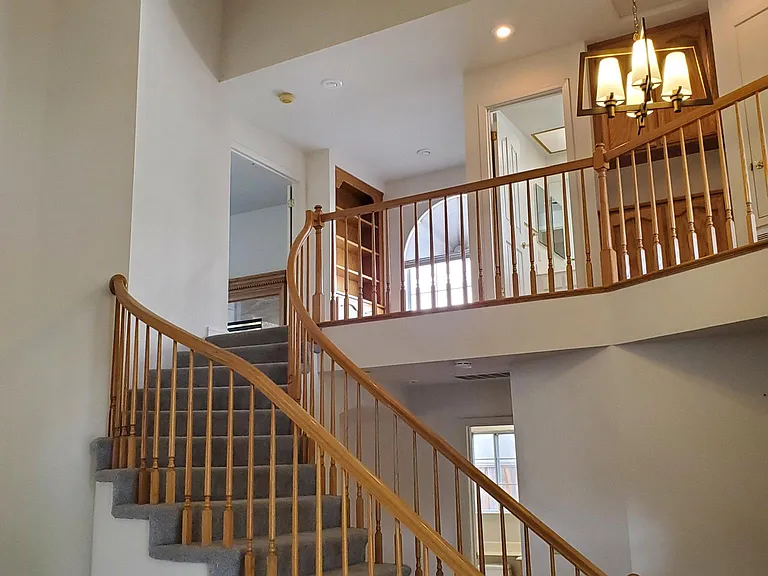 View from living room towards steps to upstairs 2nd floor.