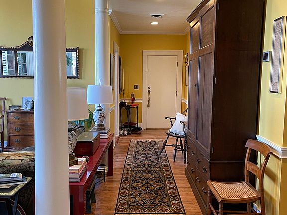 Far end of "hall" off living room looking toward front door