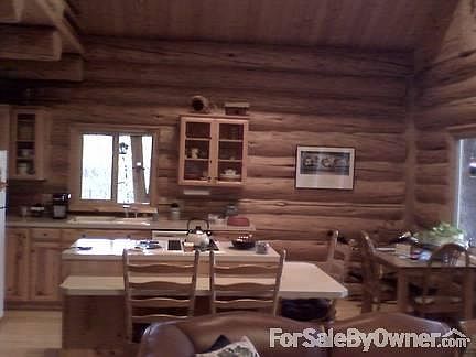 Living room
						:
						Large windows, and a wood burning stove makes this the place to be