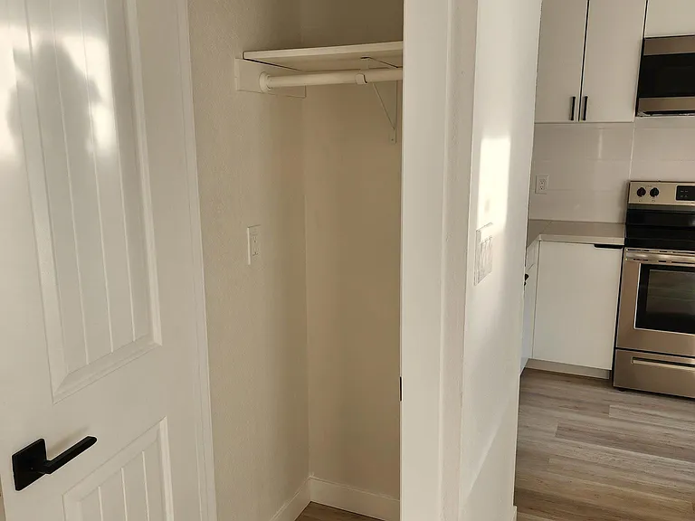 Coat closet off of kitchen