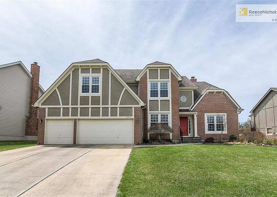Stunning Brick and Stucco Front Elevation with Dramatic Professional night lighting.Note: all new windows.  Wow! three car garage. Front faces East.