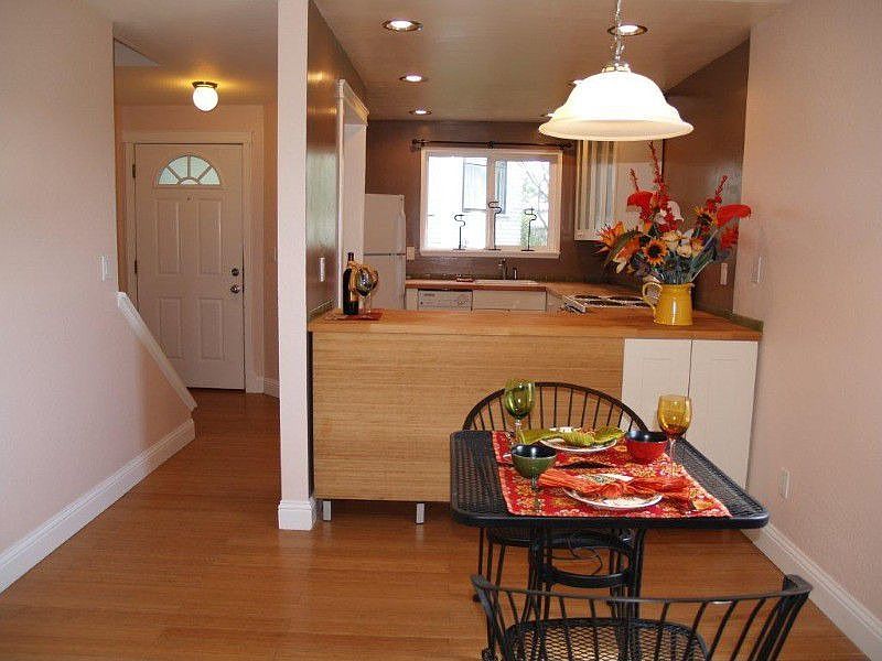 Updated open kitchen to dining area with bamboo flooring throughout.