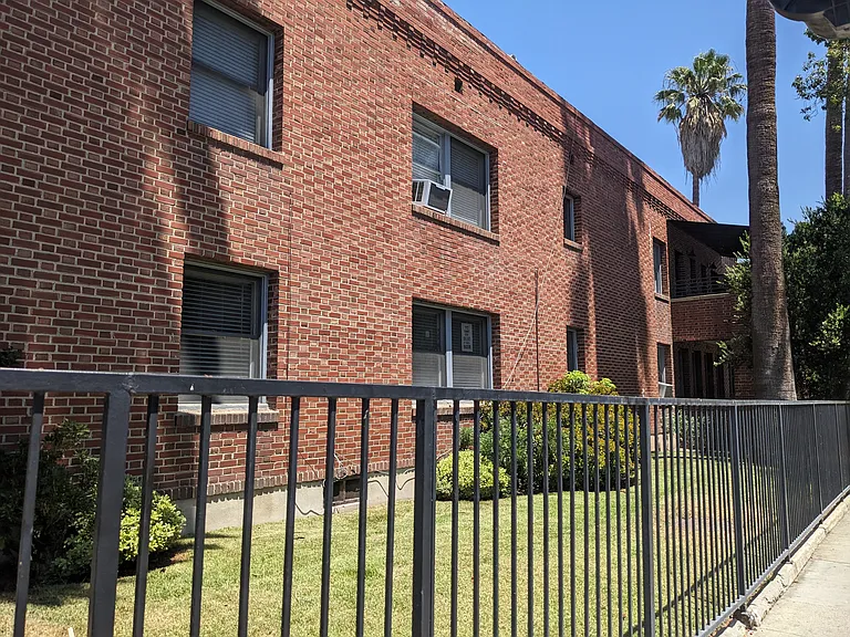 Sidewalk view of The Villas Apartments in Pasadena, California.