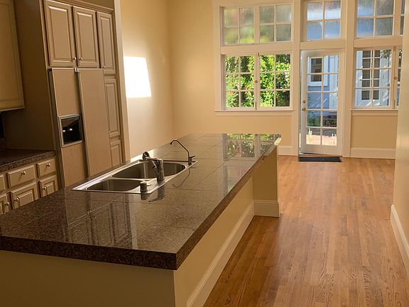 Light-filled kitchen looking out to back yard.