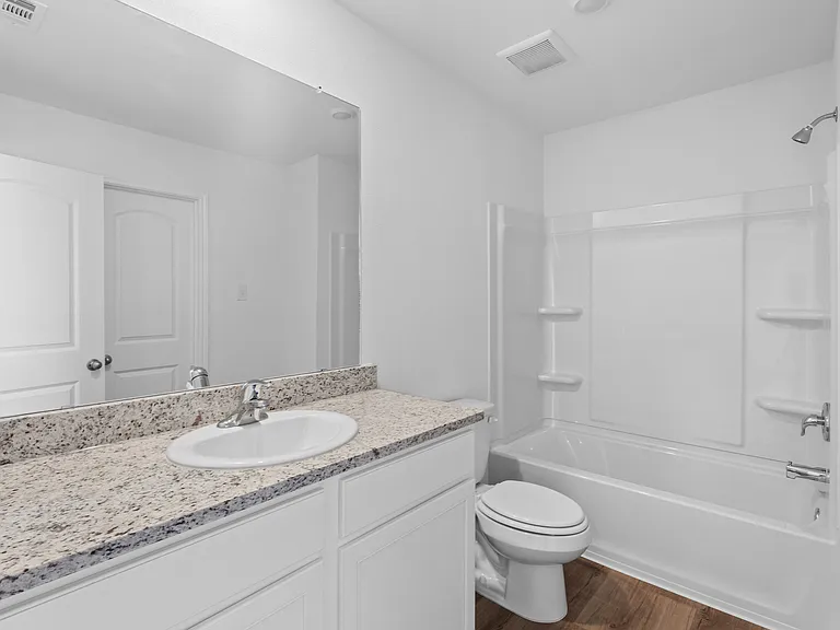 Bathroom attached to a bedroom.