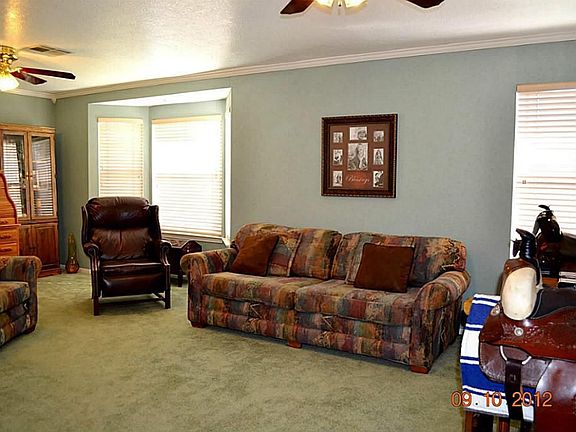 The large family room is at the rear of the home with view of backyard.