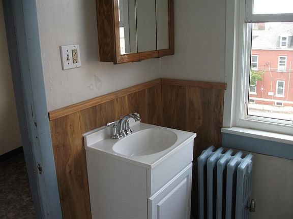 bathroom with tub, new sink and cabinet