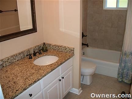 Upstairs tile bathroom with granite.
