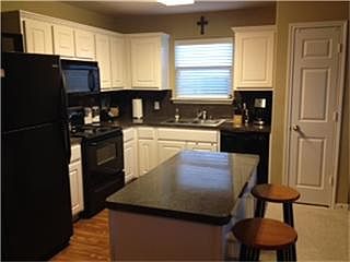 Functional island in kitchen with storage. Great cabinet space and a pantry.