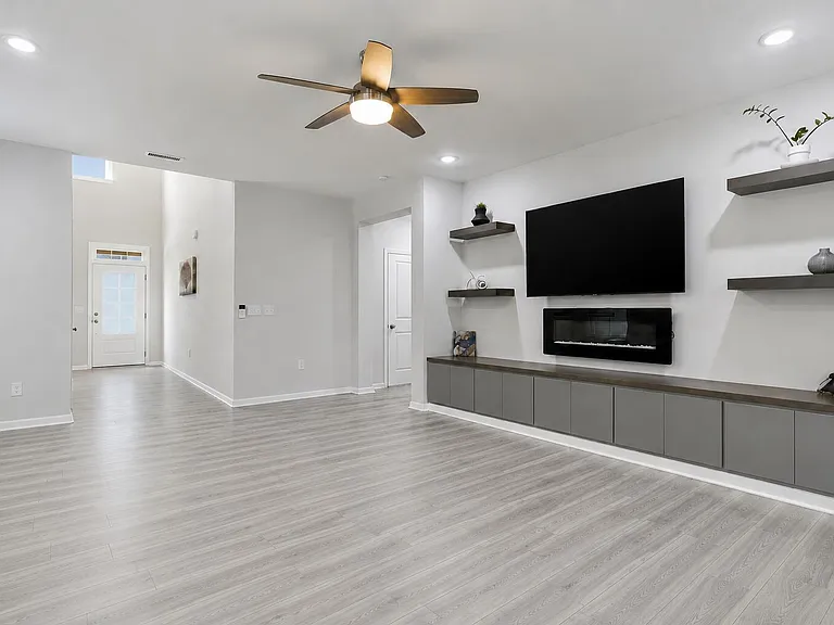 Living Area with Entertainment Center view toward entrance