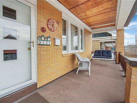 RELAX ON YOUR COZY FRONT PORCH AS SPRING AND SUMMER QUICKLY APPROACH