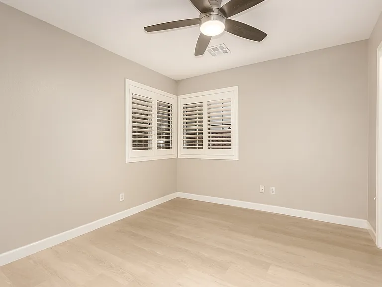 Bedroom 4 with a Walk-In Closet and Cul-de-Sac / Community Tree Views