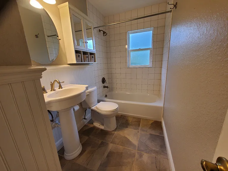 Cottage style remodel. Completely updated guest bathroom