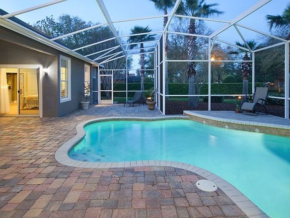 Fantastic pool features water feature and loads of brick pavers.