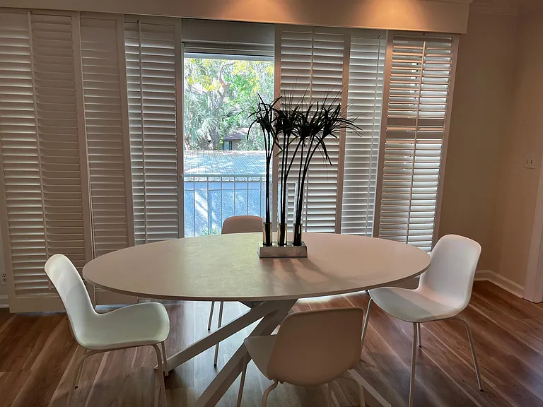 Dining Area with sliding plantation shutters opens to an outdoor balcony/sitting area. Open the sliding door and enjoy the balmy South GA weather