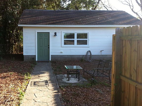 Tiny House :~) Yard now has a white vinyl fence.