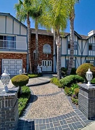 Dramatic Entry showcases pebble/tiled pathway/beautiful hardscap