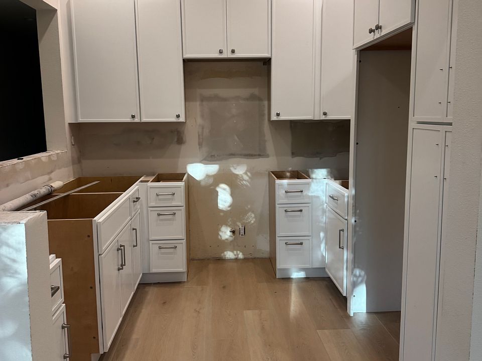 All new kitchen cabinets and LVP flooring. New ceiling lights. Countertops to be installed next week. All new appliances & new paint following countertops installation.