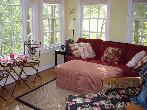 Sunroom overlooking wooded backyard