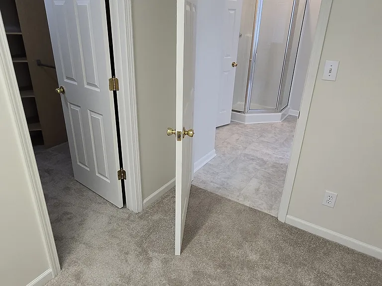 Bonus room looking to primary closet and bath