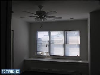 Master bedroom with ceiling fan, walk in closets, recessed lighting and a seat
