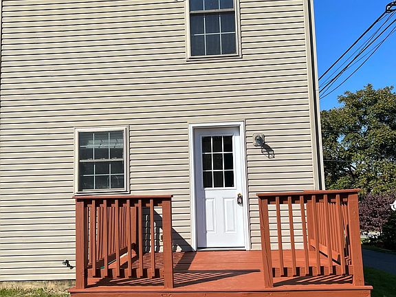 Back view of house and freshly painted deck.