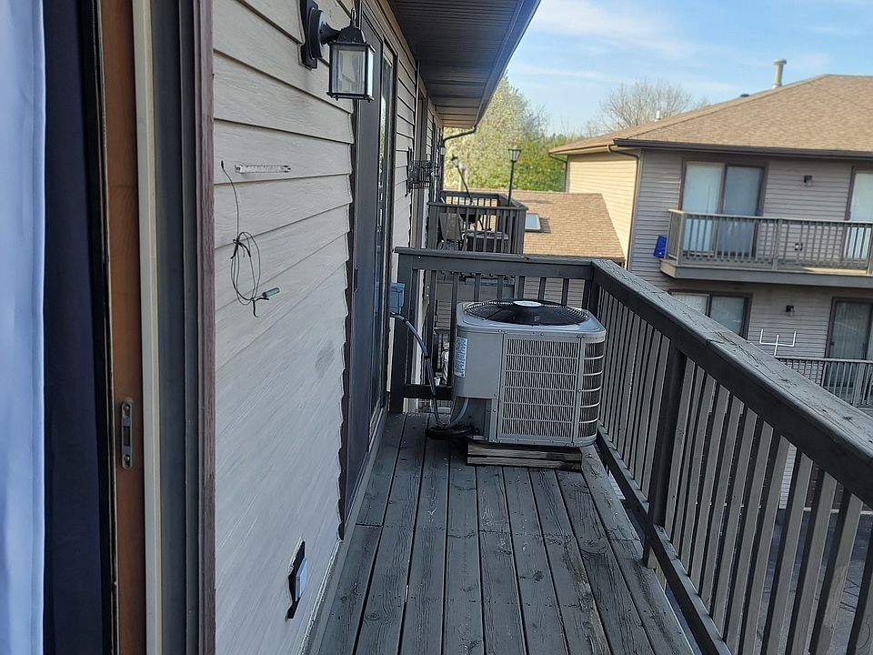 Balcony with 2 sliding doors. One from livingroom, and the other from dining room. Lots of natural light, and beautiful sunset