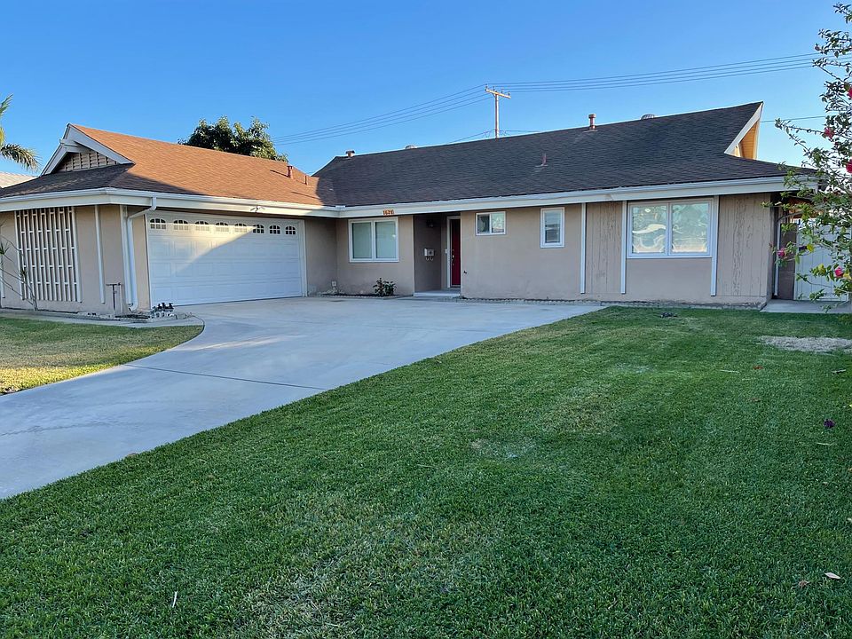 Front view of home with two car garage.
