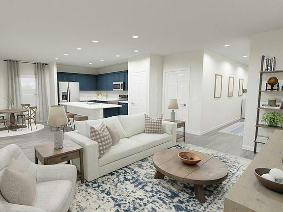Downstairs, enjoy a welcoming, open-concept living area - Rendering of the Blakely by Highland Homes