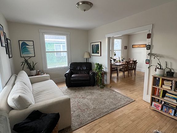 Living room, standing at the front entrance of the unit