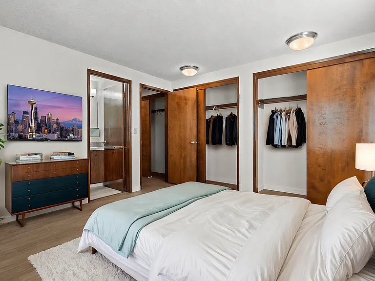 Spacious bedroom with dual closets and convenient bathroom access Spacious bedroom with dual closets and convenient bathroom access
