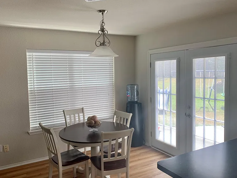 Dining Room next to kitchen with easy access to French Doors/Rear Patio.
