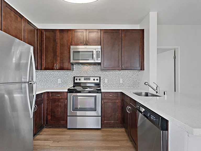 Newly renovated kitchens feature stainless steel appliances and updated finishes