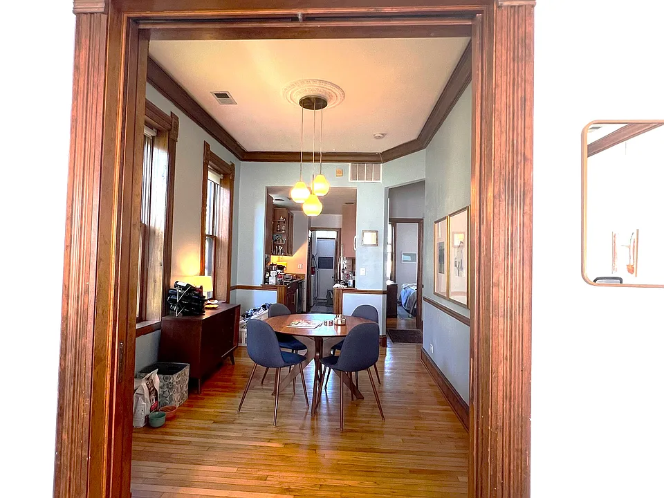 Original pocket door and large dining room