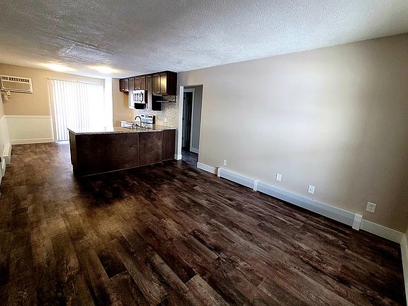 Living, Dining, Kitchen w/ slider access to patio.