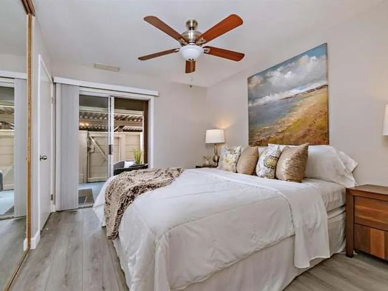 Bedroom #1 with sliding doors to access patio