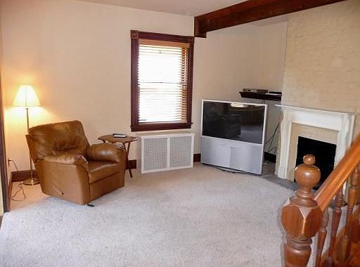 Living room with decorative fireplace